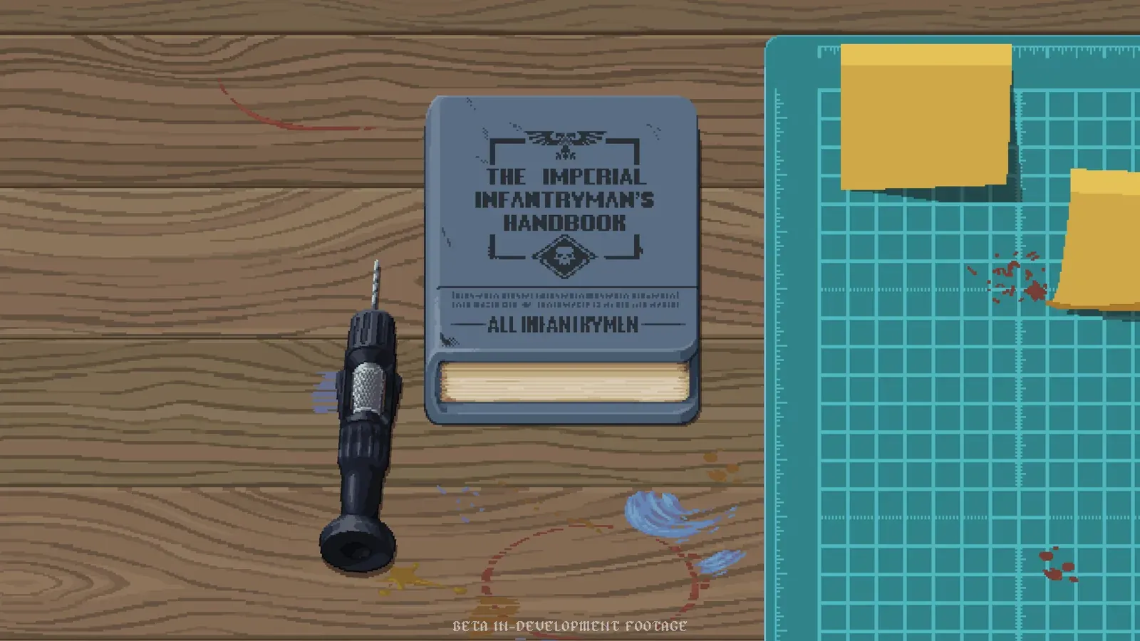 A Warhammer hobby cutting mat and tools used for the Hobby Table stage